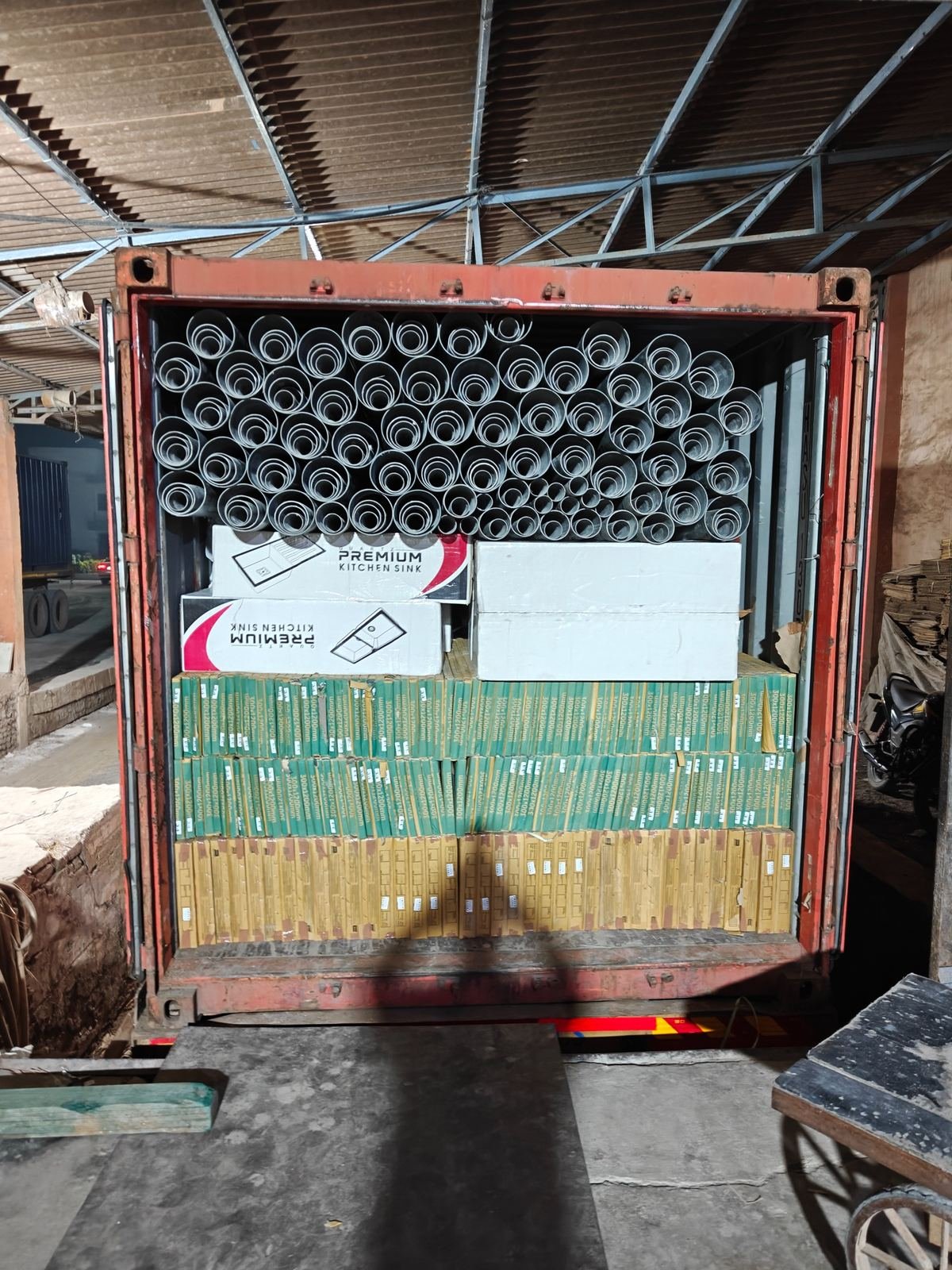 Kitchen sink cartons loaded with tile cartons and pipe coils